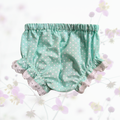 Green polka dot baby bloomers with lace trim